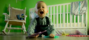 messy toddler in room