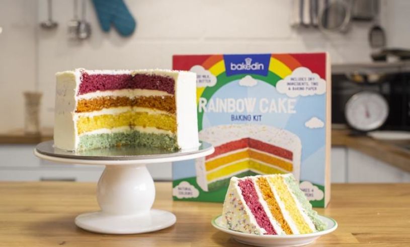 a finished rainbow cake and the box in the background