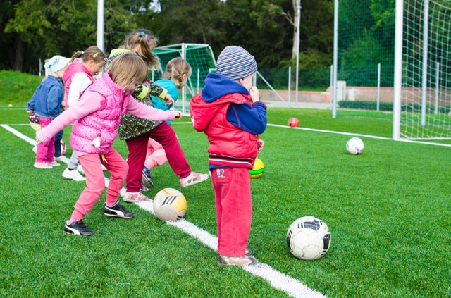 a group of young children playing football