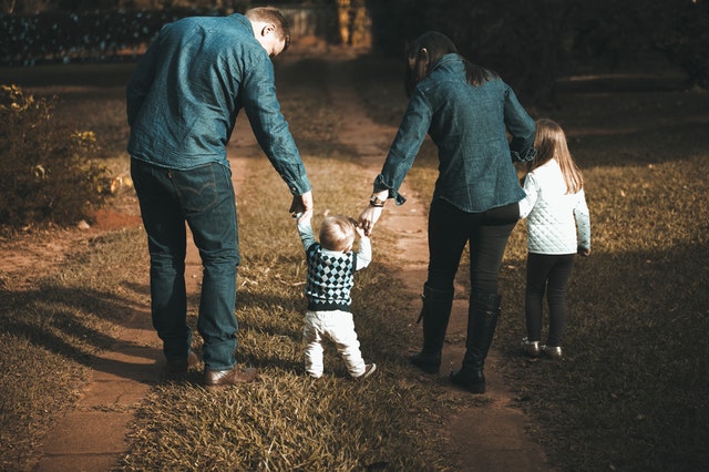 a family of four on a nature walk