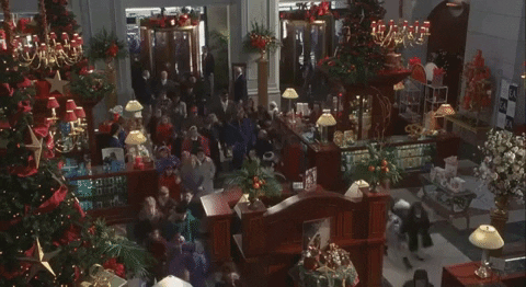 people running into christmas shop