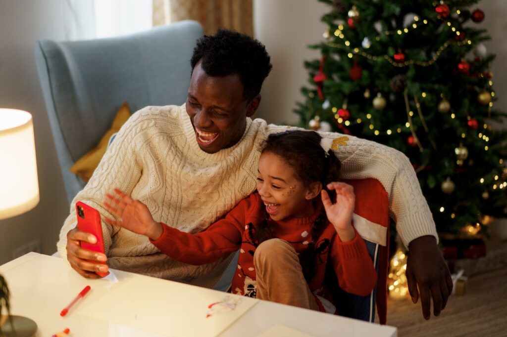 Parent and child reading Christmas Jokes