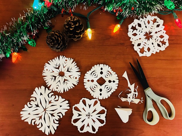 White paper snowflakes cut out with scissors