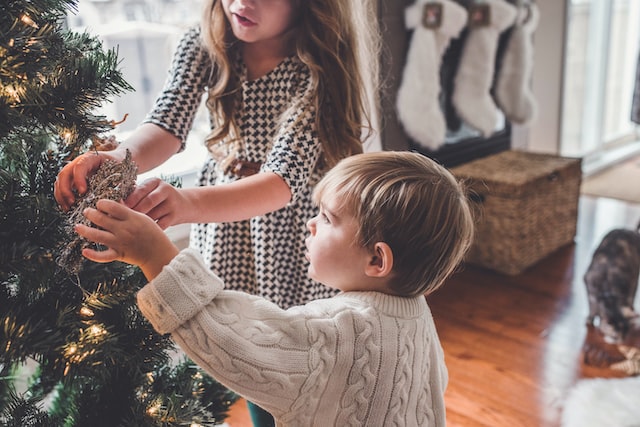 Kids Christmas activities decorating Christmas tree